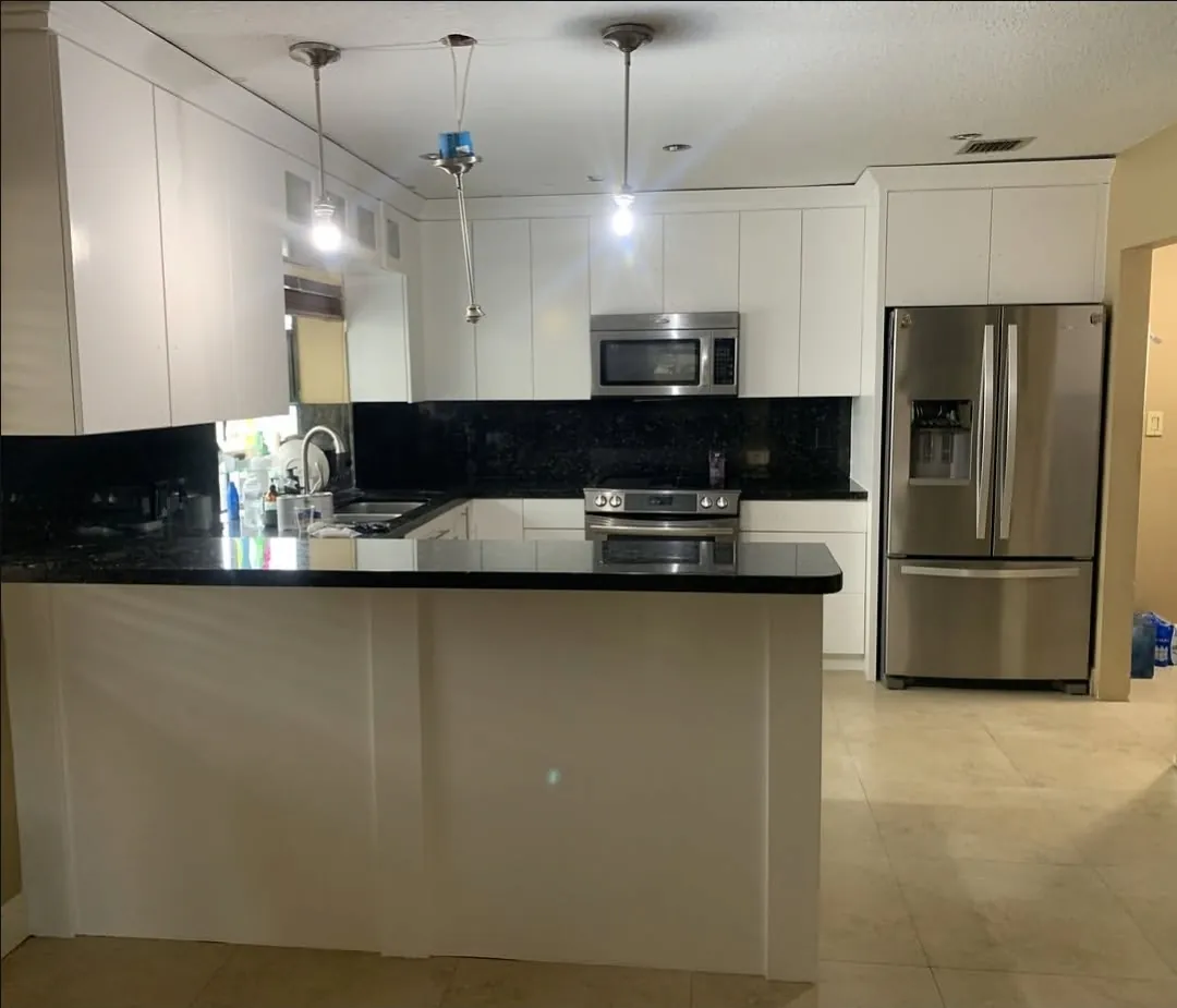Kitchen cabinets refinished in white by All County Painters