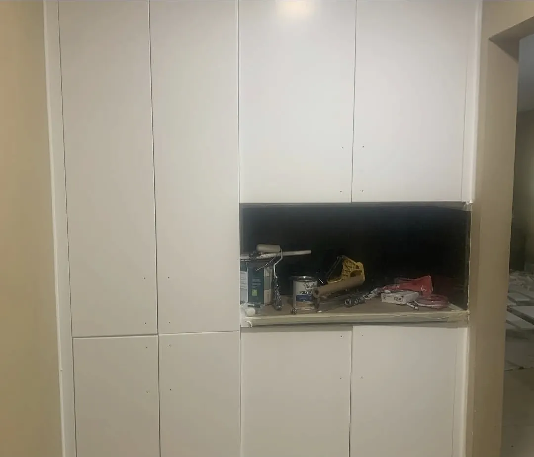 White painted flat-panel cabinet wall unit — detail