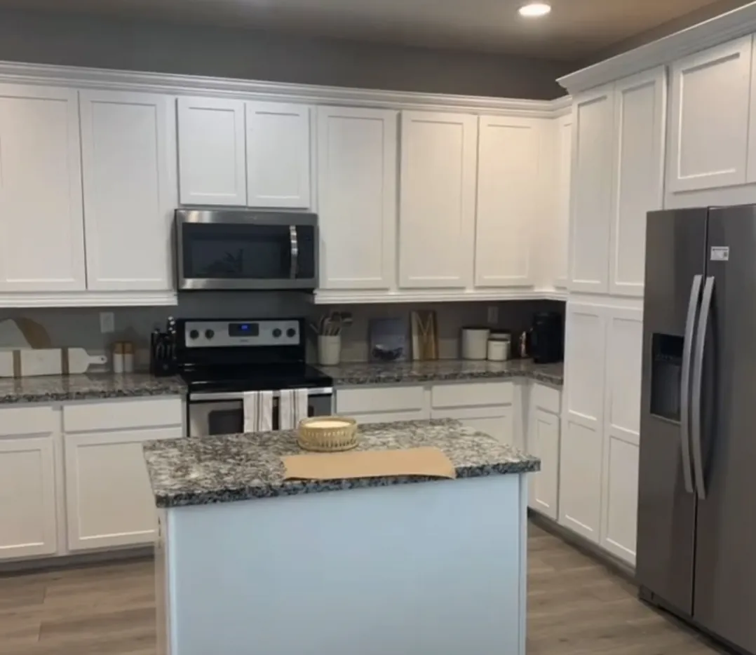 Finished white shaker kitchen cabinets with island after cabinet painting by All County Painters