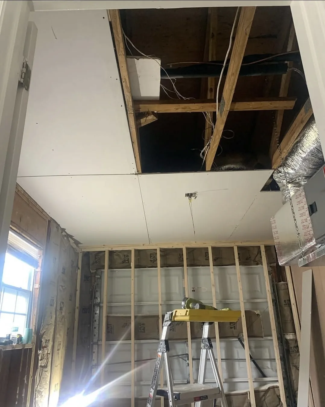Ceiling framing exposed during drywall repair