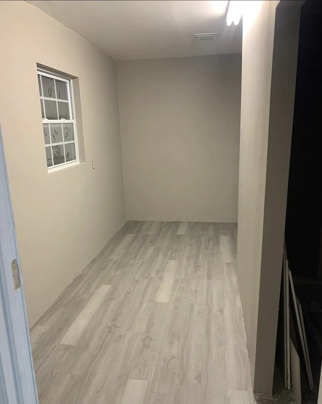 Finished room with painted walls and new flooring