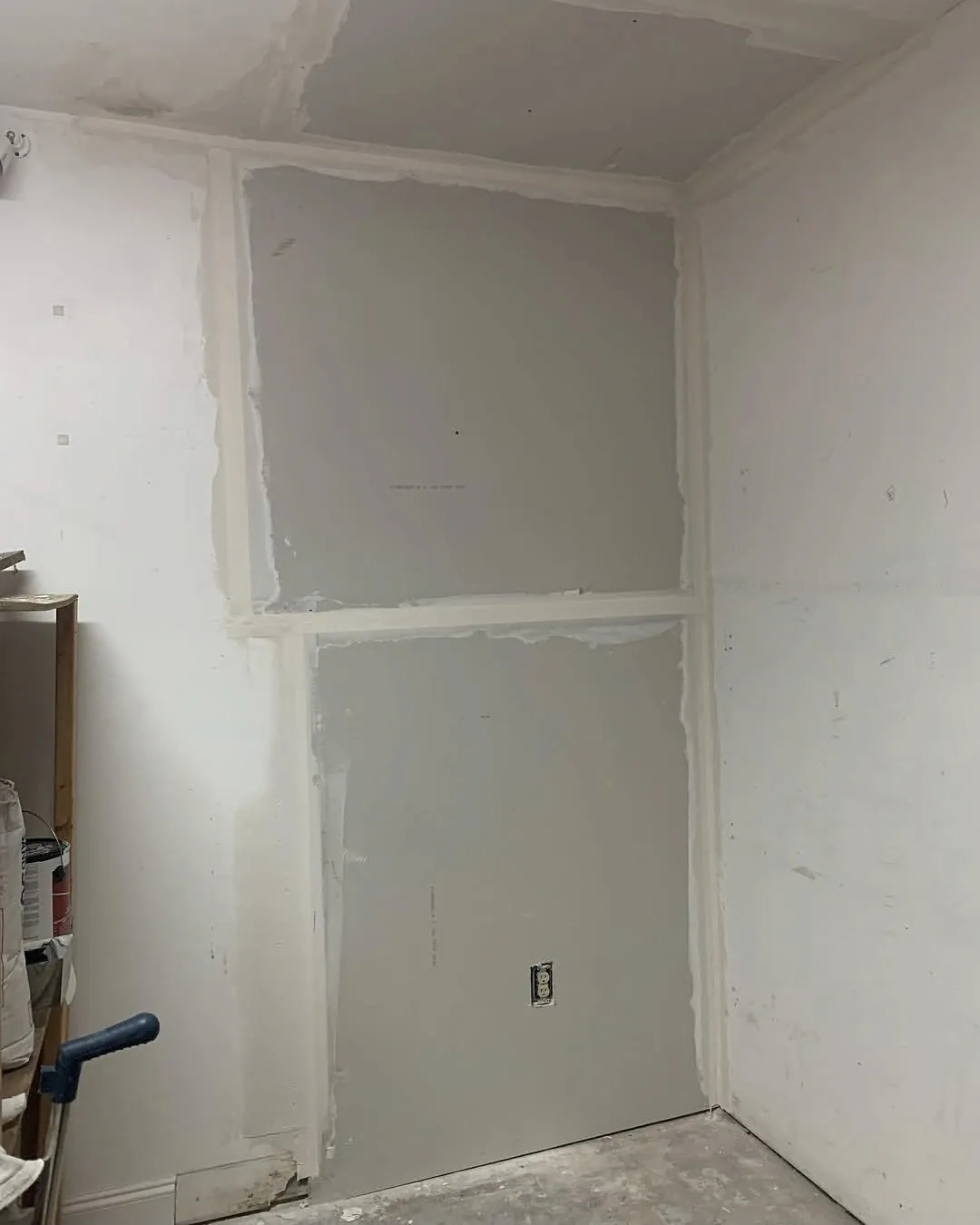 New drywall hung and taped, ready for finishing