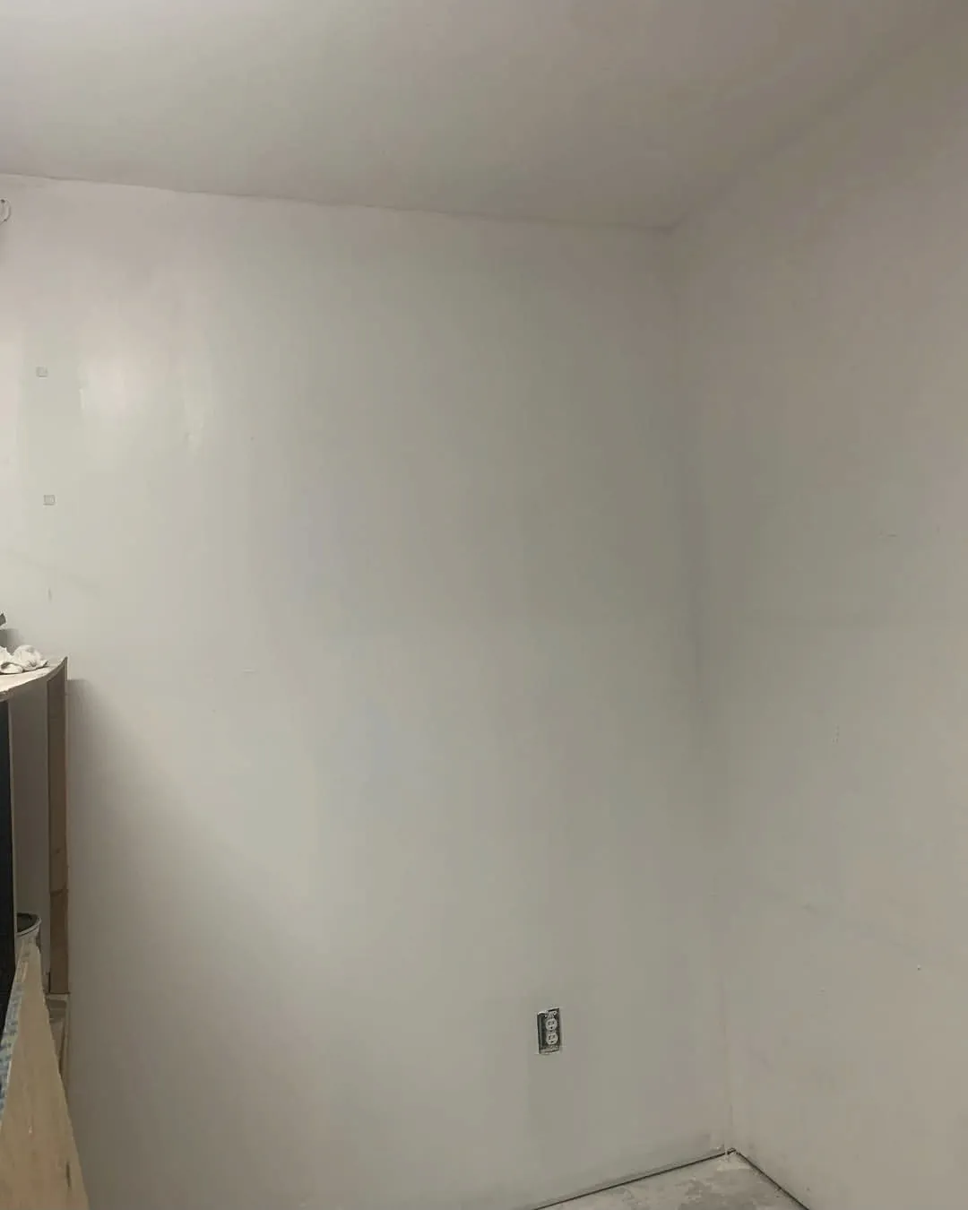 Finished wall painted white after skim coating