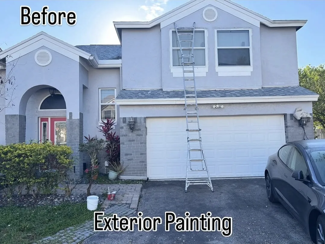 Two-story home before exterior painting, faded finish