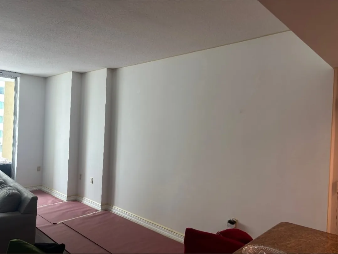 White limewash walls in progress in a Miami high-rise condo